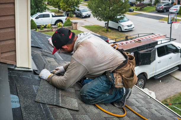 Professional Storm Damage Roof Repair technician working in White Hall, IL